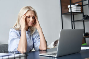 A woman in the office with menopause memory fog