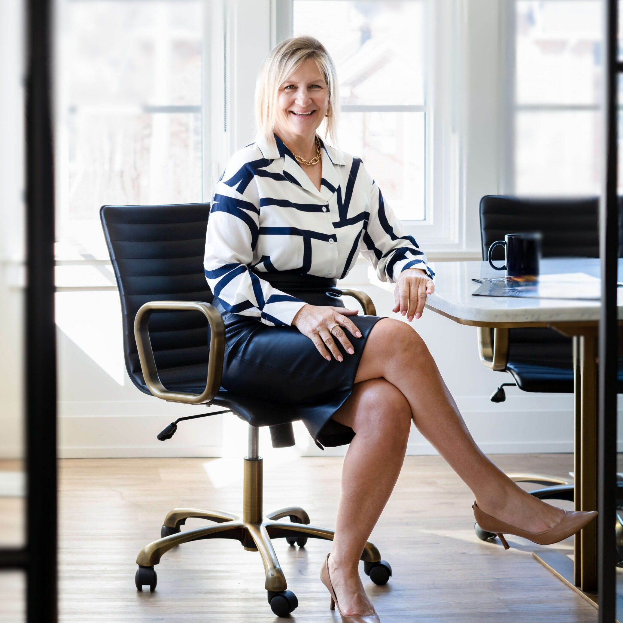 Karen Roy sitting in an office chair